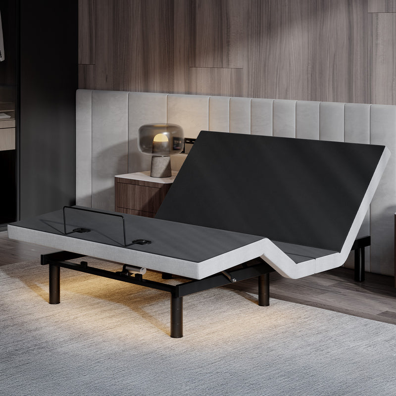 Adjustable bed base with raised head and foot sections